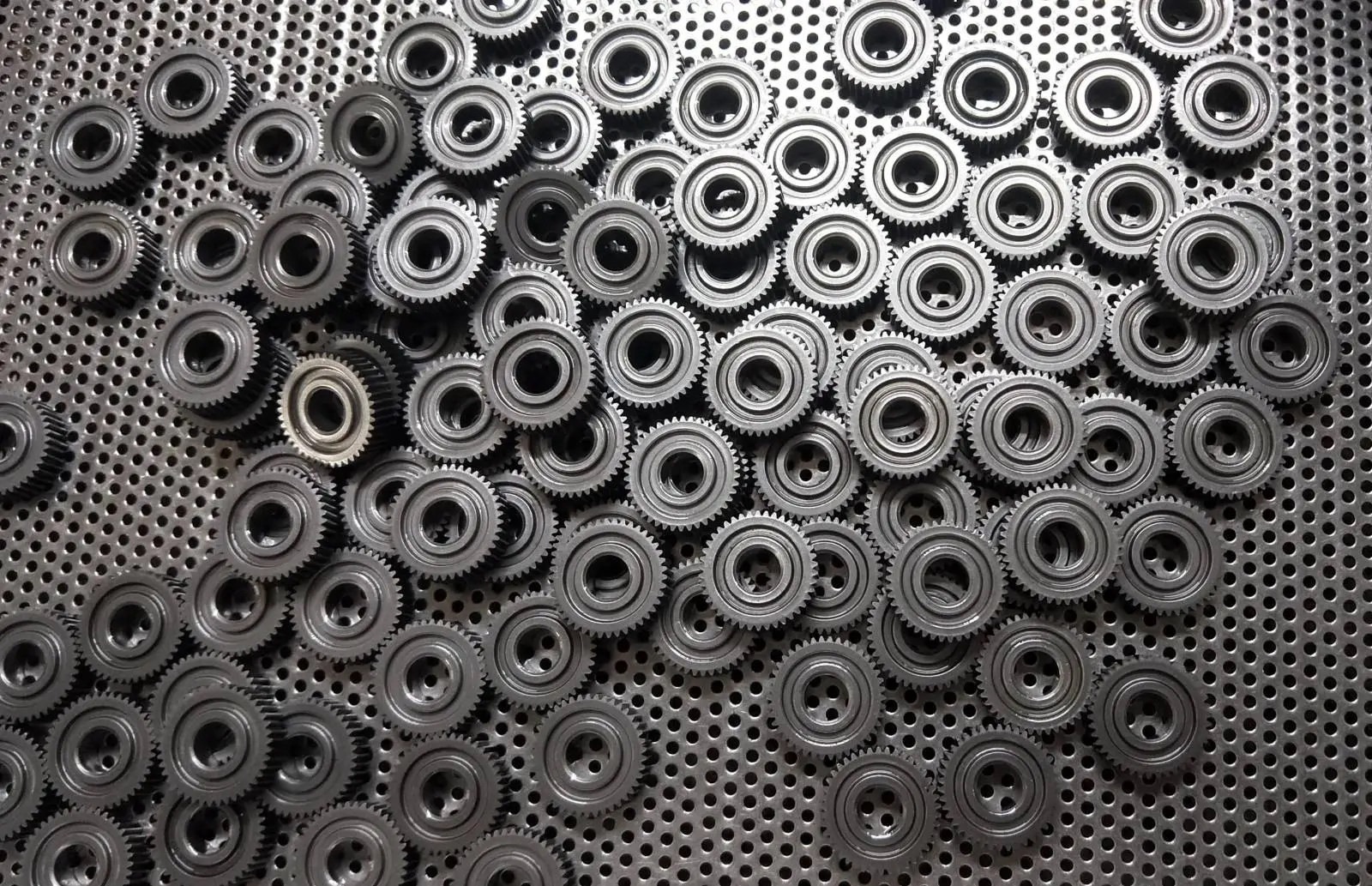 Batch of identical sintered gears on the production tray